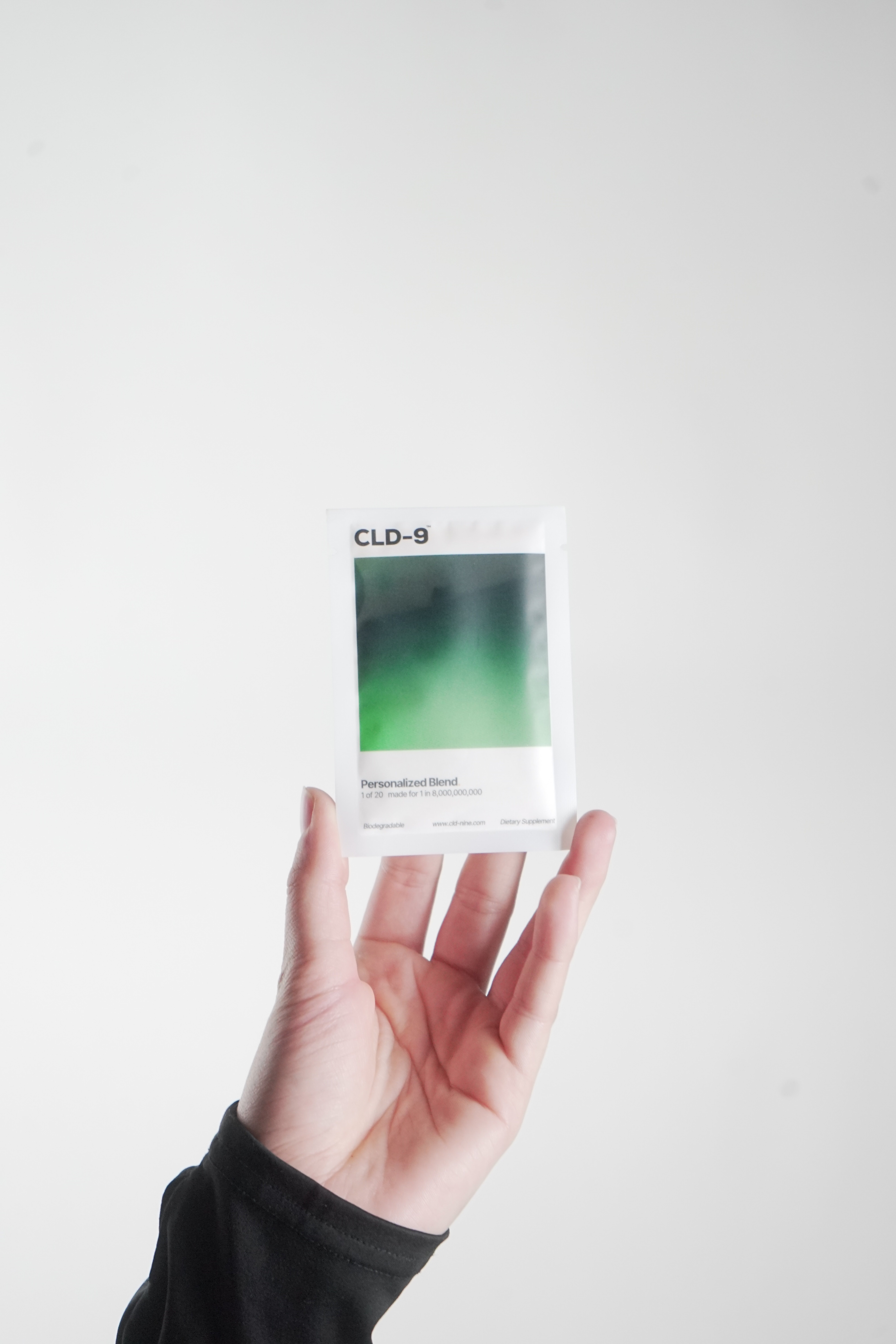 Hand holding supplement containers